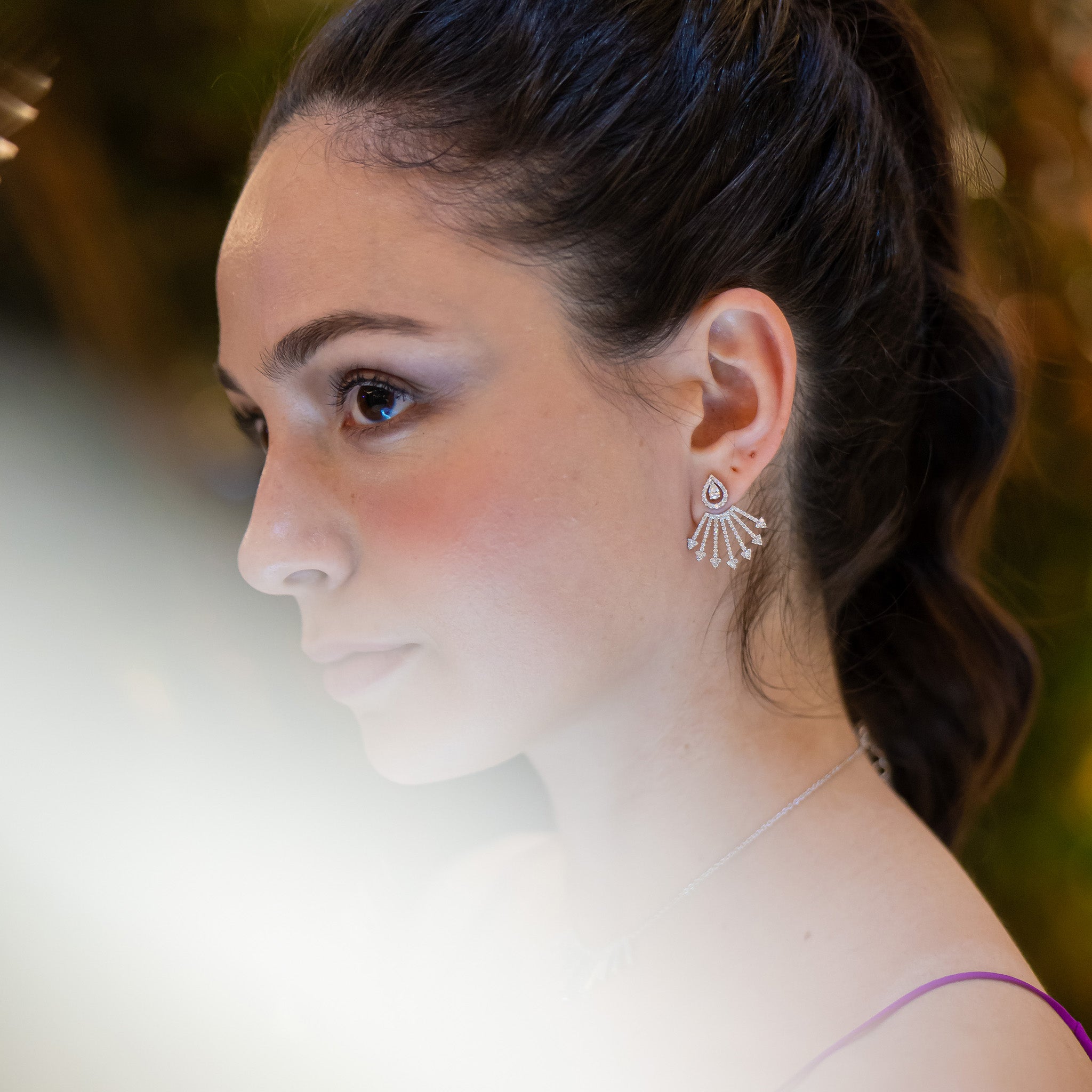 Diamond stud earrings with optional extensions, fine jewellery showcased on a model.