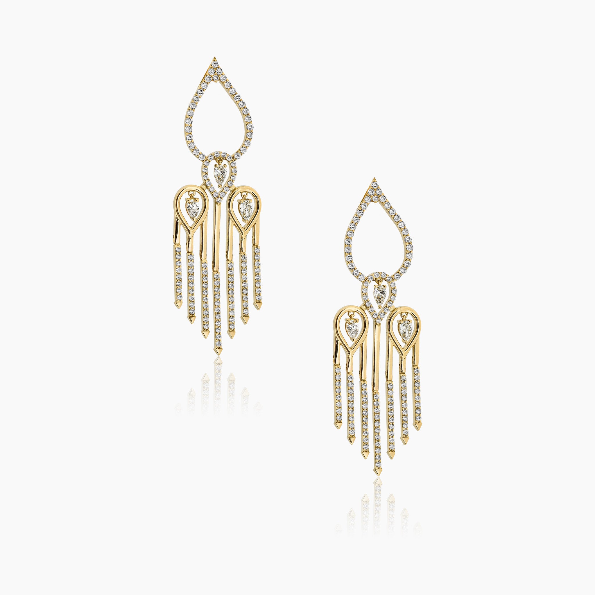 Sahara yellow gold earrings adorned with white diamonds, displayed against an off-white background.
