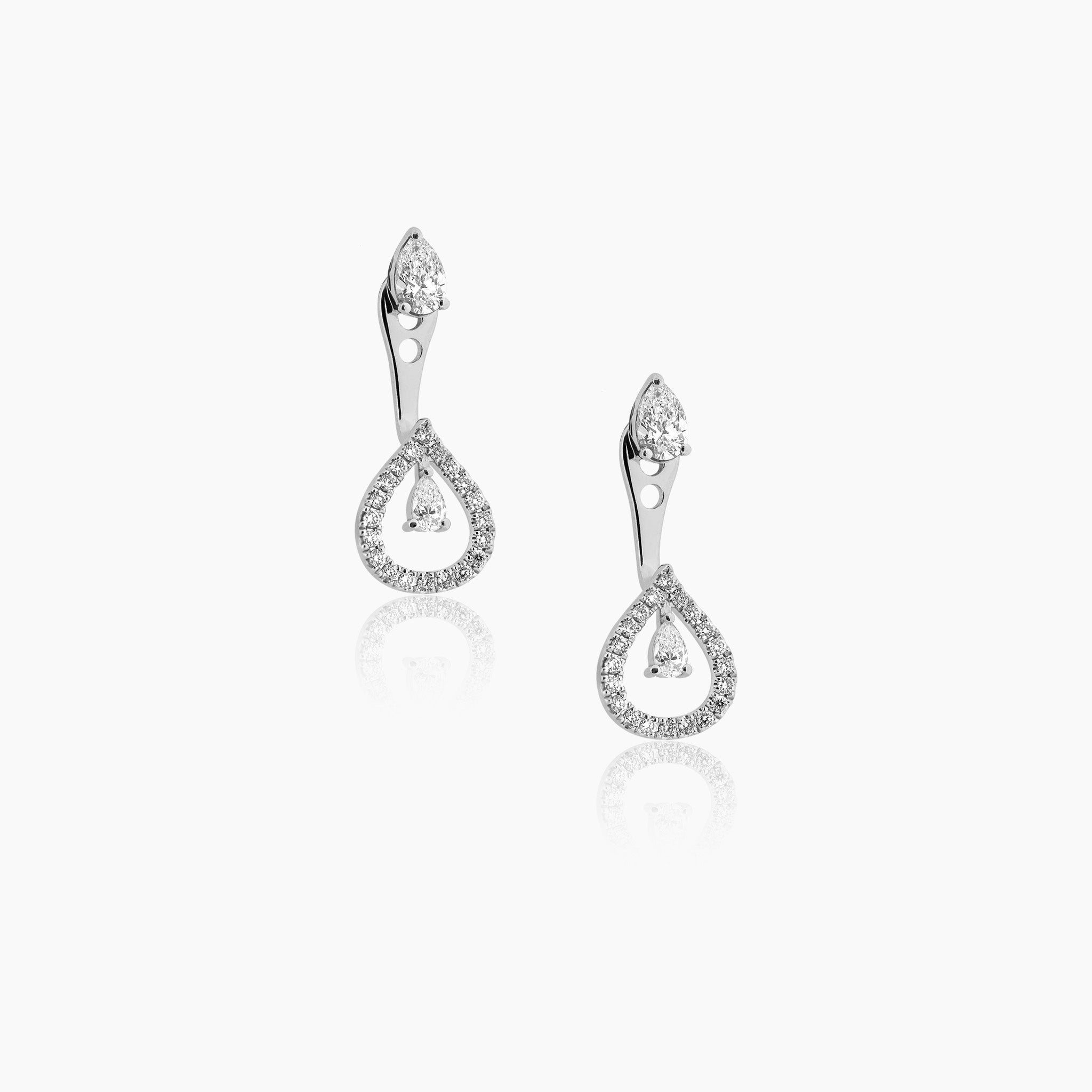 Venus single diamond earrings featuring a pear-shaped stud convertible design with additional extension diamonds, displayed on an off-white background.