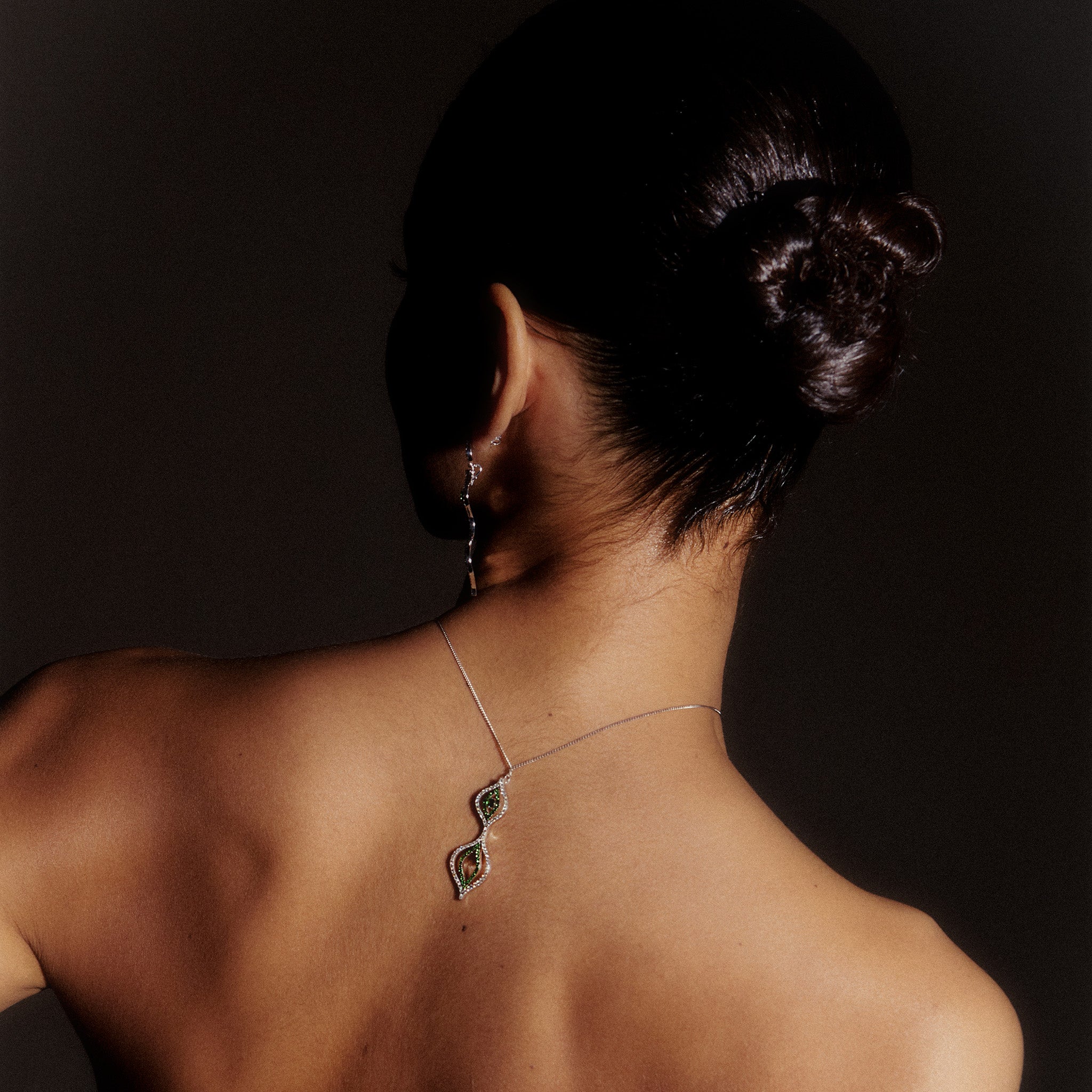 Model Wearing Venus Pendant: A model showcasing the exquisite Venus Pendant, highlighting its grace and elegance. 