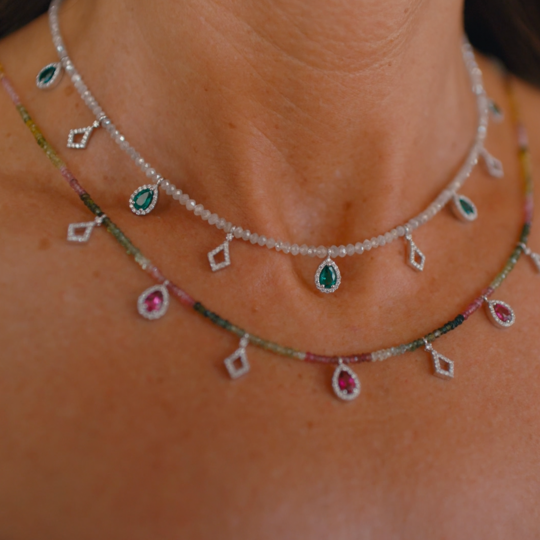 Necklace with Natural Grey Diamond Beads, Emeralds & Diamonds displayed on model 