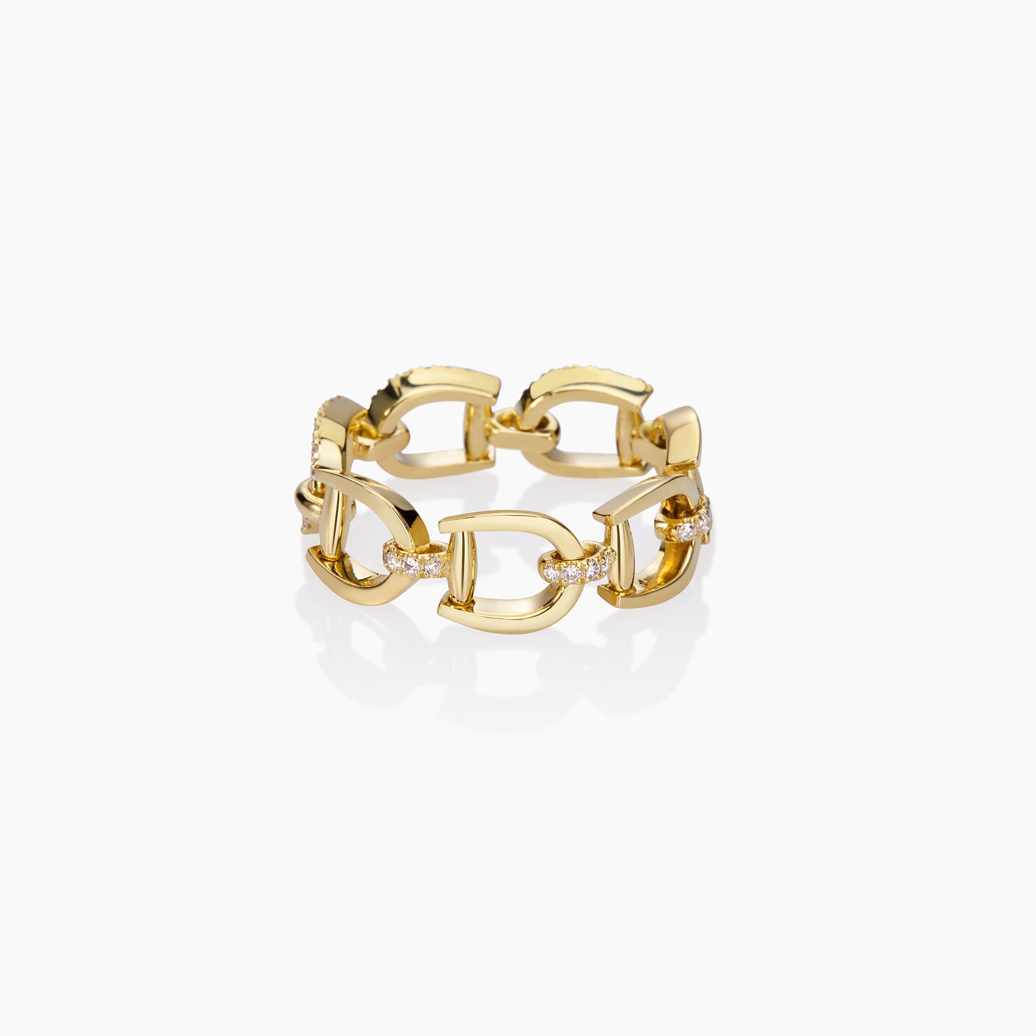 Versatile Fulanda Horsebit Chain Ring  in yellow gold displayed on an off white background.
