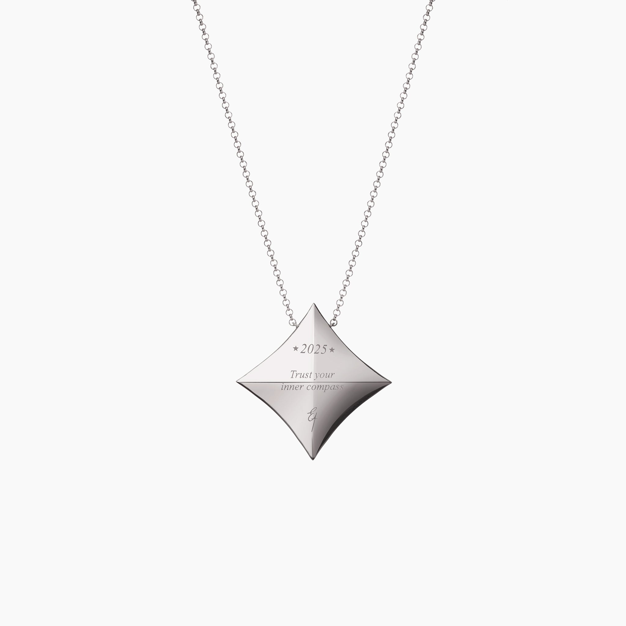 2025 Trust Your Inner Compass Lucky Charm against an off white background in white gold