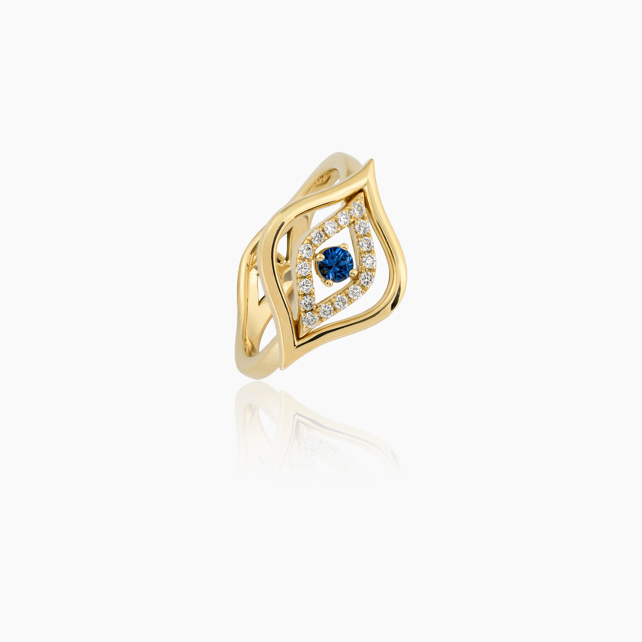 A stunning diamond and sapphire ring, presented on an off-white background.